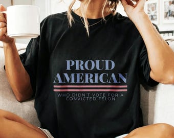 Black Graphic Shirt With Bold Blue Text Print, Sarcastic Political Statement Design, Patriotic Slogan Style For Everyday Wear