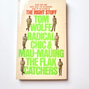 May include: A book cover with a white background and green text. The title is "Radical Chic & Mau-Mauing the Flak Catchers" by Tom Wolfe. The book is by the author of "The Right Stuff".