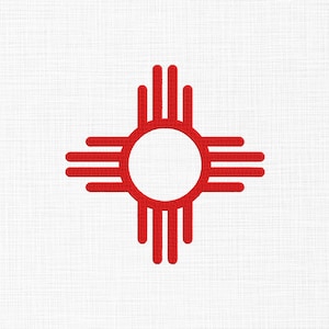May include: A red Zia sun symbol embroidered on a white fabric background. The design features a central circle with four groups of four parallel rays extending outward in cardinal directions, creating a cross shape with a textured stitch pattern.