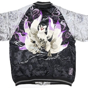 May include: A black and silver satin bomber jacket featuring a large, detailed embroidery of a multi-tailed fox on the back. The design includes purple and white accents, swirling smoke patterns, and floral motifs on the sleeves with a small rectangular patch.