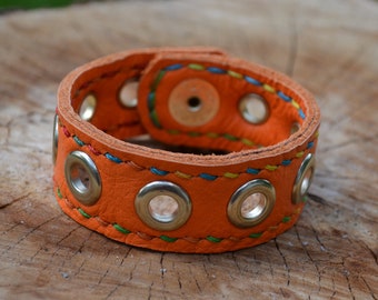 Orange leather bracelet with eyelets - Hand stitched, customizable