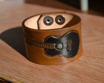 Leather cuff with hand tooled Guitar