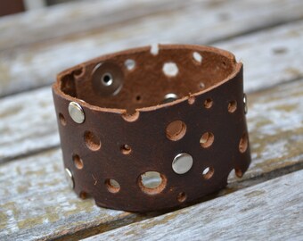 Leather cuff bracelet with cut out circles and rivets