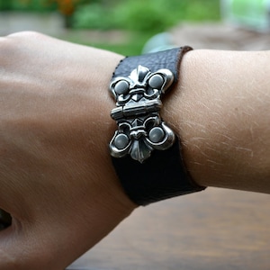 Leather bracelet cuff with decorative working hinge and snap closure
