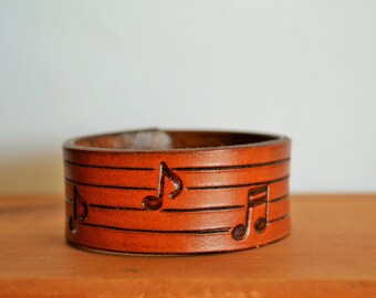 Leather cuff with hand stamped music notes - Hand tooled