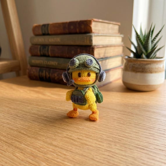 A crocheted rubber duck dressed in full military gear — the specificity of 'soldier duck' is exactly the kind of weird-cool crossover that wins white elephant exchanges.