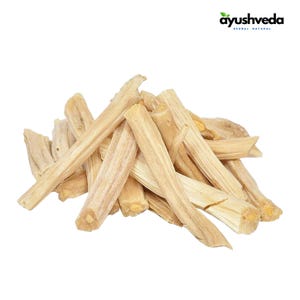 May include: A pile of light brown, dried sticks, possibly herbs or spices, against a white background. The sticks are of varying lengths and thicknesses, with a rough, textured appearance. The top right corner features the text "ayushveda HERBAL NATURAL".