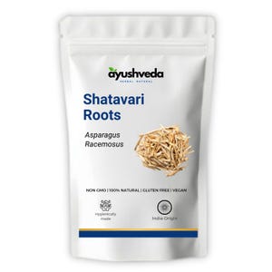 May include: A white pouch of Shatavari Roots, a herbal product. The package features the brand name "ayushveda" and the text "Shatavari Roots, Asparagus Racemosus." The pouch also states "NON GMO | 100% NATURAL | GLUTEN FREE | VEGAN."