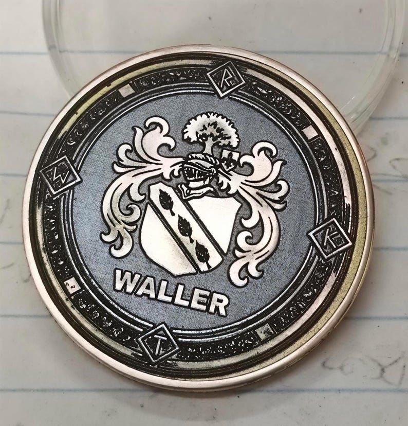 Heraldic challenge coin with coat of arms and WALLER text, crisp contrast showcasing metal engraving settings.