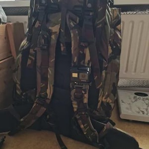 May include: A set of three ceramic mugs with a speckled, matte finish. The mugs are in shades of cream, light gray, and dark gray. Each mug has a simple, minimalist design and a rounded handle.