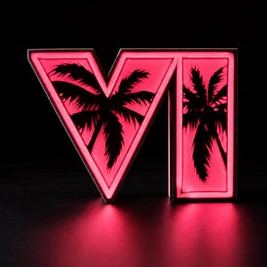 Può includere: Una scatola luminosa tridimensionale a forma di lettera V e lettera I con un bagliore neon rosa brillante. I pannelli frontali presentano sagome nere di palme su uno sfondo rosa illuminato, creando un contrasto elevato.