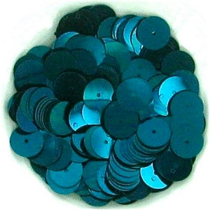 May include: A large pile of teal green sequins. The sequins are round and have a hole in the center. They are perfect for crafting and sewing projects.