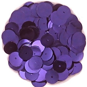 May include: A large pile of purple sequins, perfect for crafting and decorating.