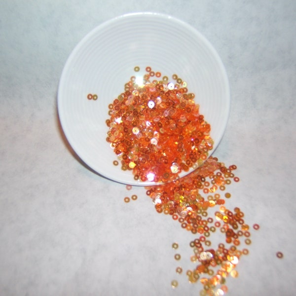 Apricot Crystal Iris  3mm, 1/2 oz package Center Hole Garment Ready Sequins