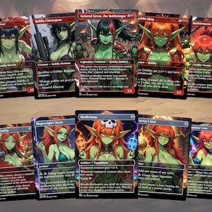 May include: A collection of ten rectangular trading cards featuring anime-style green-skinned goblin characters. Each card displays unique artwork, character names like General Kreat and Skullclamp, descriptive text, and game statistics printed in white and red fonts.