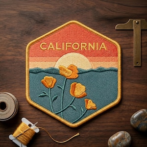 May include: Embroidered patch with a California poppy design. The patch features a sunset scene with the word "CALIFORNIA" stitched across the top. The design includes orange poppies, a blue ocean, and a setting sun. The patch has a gold border.