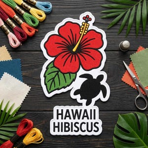 May include: A white embroidered patch featuring a large red hibiscus flower with a yellow stamen, a green leaf, and a black sea turtle silhouette. Below the graphic, the text HAWAII HIBISCUS is embroidered in black capital letters on a white background.