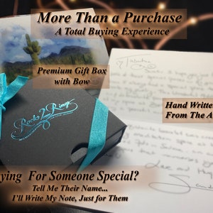May include: A black gift box with a blue ribbon and bow. The box has the words "Rocks 2 Ring" printed on it. The box is sitting on a white card with the text "Buying For Someone Special? Tell Me Their Name... I'll Write My Note, Just for Them".