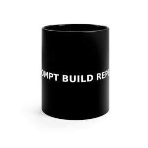 May include: Black ceramic mug with the white text "PROMPT BUILD REPEAT" around the side. The mug is cylindrical and has a glossy finish. A simple, modern design for a coffee or tea lover.