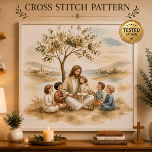 May include: A cross stitch pattern featuring a central figure with long hair and a beard sitting under a tree, surrounded by five children. The scene includes a landscape with hills and water in muted earth tones. Text reads CROSS STITCH PATTERN.