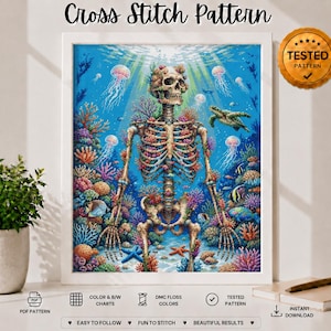 May include: A cross stitch pattern featuring a human skeleton surrounded by a vibrant coral reef, jellyfish, and a sea turtle in deep blue water. The design includes a gold seal labeled TESTED PATTERN and text indicating PDF format, DMC floss colors, and instant download.