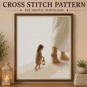 May include: A cross stitch pattern PDF digital download featuring a child in a light-colored dress holding a lantern while walking beside large, bare feet. The text at the top reads CROSS STITCH PATTERN PDF DIGITAL DOWNLOAD and BE STILL AND KNOW THAT I AM GOD.