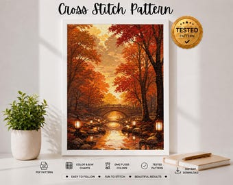 May include: A cross stitch pattern featuring an autumn forest scene with orange and red trees, a stone bridge over a stream, and glowing lanterns. The image includes the text Cross Stitch Pattern and a gold seal labeled TESTED PATTERN.
