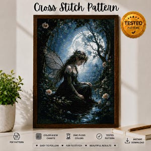 May include: A cross stitch pattern featuring a fairy with wings sitting by a stream under a full moon in a dark forest. The image includes text reading Cross Stitch Pattern and a gold seal stating Tested Pattern with icons for PDF and download.