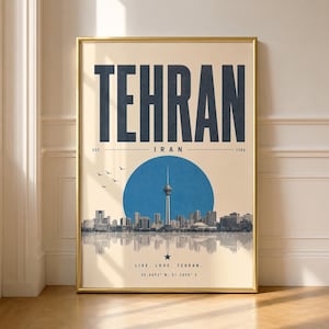 May include: A vertical wall art print featuring the word TEHRAN in large dark blue letters above a blue circle containing the Milad Tower. The skyline is reflected below with the text EST. 1784, LIVE, LOVE, TEHRAN, and coordinates 35.6892 N, 51.3890 E.