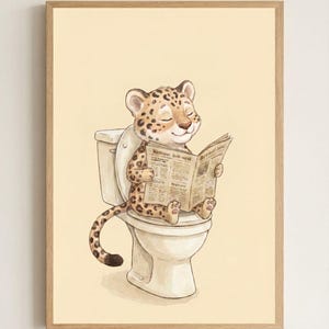 May include: A framed art print featuring a cartoon leopard sitting on a toilet and reading a newspaper. The leopard has a spotted coat and is smiling with its eyes closed. The background is a light yellow color.