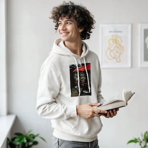 May include: A set of three ceramic mugs with a speckled, matte finish. The mugs are in shades of cream, light gray, and dark gray. Each mug has a simple, minimalist design and a rounded handle.