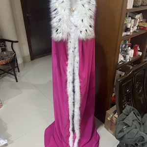 May include: A rustic wooden sign with the text "Welcome to our home" in white lettering. The sign has a distressed finish and a simple, inviting design, suitable for a front porch or entryway.