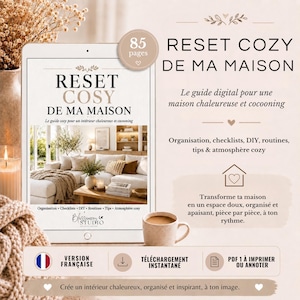Peut inclure: Un guide numérique intitulé RESET COZY DE MA MAISON comprenant 85 pages de conseils d'organisation. La couverture montre un salon avec un canapé blanc, une table basse en bois et du texte en français. Inclut des icônes de téléchargement et PDF.