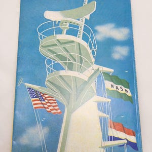 May include: A vintage Holland-America Line brochure from January 1, 1966, titled Sailings & Fares Transatlantic Passenger Service. The cover features a white ship mast against a blue sky, displaying the American flag, a NASM flag, and the Dutch flag.