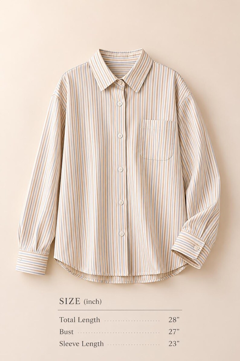 Puede incluir: Una camisa de manga larga con botones y un patr&oacute;n de rayas verticales en color canela, azul y blanco. Cuenta con cuello, un bolsillo en el pecho y pu&ntilde;os abotonados. El texto indica una longitud total de 28 pulgadas, un busto de 27 pulgadas y una longitud de manga de 23 pulgadas.