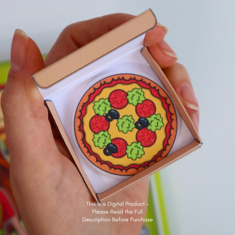 May include: A colorful pizza illustration with tomatoes, olives, and lettuce, inside a miniature cardboard pizza box. The pizza has a yellow base and a red crust. Text at the bottom reads: "This Is a Digital Product - Please Read the Full Description Before Purchase."