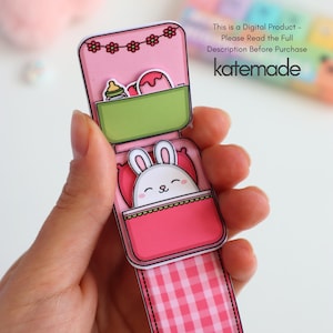 May include: A pink paper craft featuring a cartoon bunny in a bed, with a green container holding a bottle and a dessert. The top has a floral design. Text on the image reads: "This is a Digital Product - Please Read the Full Description Before Purchase katemade."