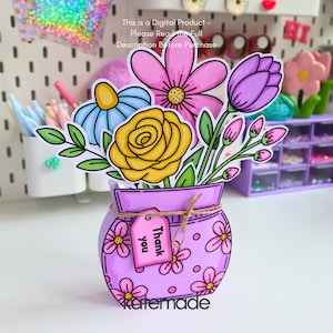 May include: A digital product illustration of a light purple vase decorated with pink flowers and a small tag that reads Thank you. The vase holds a colorful bouquet of a yellow rose, a pink daisy, a blue flower, and purple flower buds.
