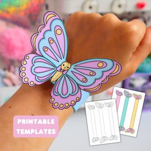 May include: A butterfly-shaped wristband featuring light blue and lavender wings with yellow circular accents and a central body. The wristband is displayed alongside two printable templates, one showing black and white outlines and one with coloured versions.