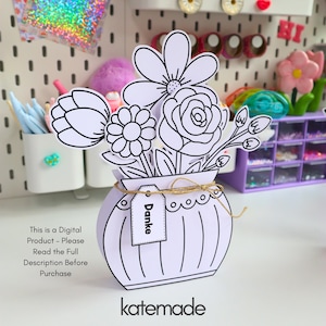 May include: A white paper craft of a flower bouquet in a vase with black outlines. The vase features a small rectangular tag with the word "Danke" printed on it, tied with a thin brown twine string. The text "This is a Digital Product - Please Read the Full Description Before Purchase" is visible on the left side.