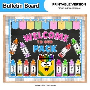 May include: A digital bulletin board display featuring the text "WELCOME TO OUR PACK" in colorful letters. The design includes a central crayon box character, various crayon-shaped name tags, and a top banner of pastel-colored pennants.