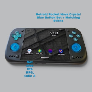 May include: A black handheld gaming console featuring a Retroid Pocket Nova crystal blue button set and matching analog sticks. The screen displays a digital clock and app icons. Text reads: Retroid Pocket Nova Crystal Blue Button Set + Matching Sticks. Set also fits RP6, Odin 3.