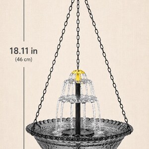 May include: A hanging water fountain with a dark gray glass bowl featuring a floral pattern, a black central pillar, and a gold-colored top piece. It includes black chains and a hook, measuring 18.11 inches in height and 9.25 inches in diameter.