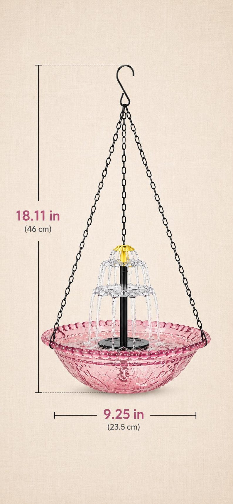 May include: A hanging fountain with a pink glass bowl featuring a textured rim and a central tiered water feature. It is suspended by black chains and a hook. The total height is 18.11 inches and the bowl diameter is 9.25 inches.