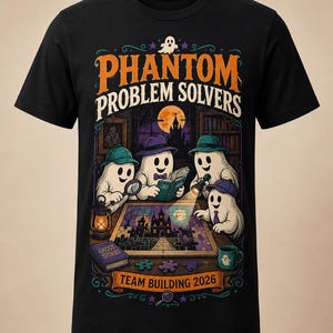May include: A black short-sleeve t-shirt featuring a graphic of four ghosts wearing hats and detective gear around a table with a puzzle. The text reads PHANTOM PROBLEM SOLVERS and TEAM BUILDING 2026, with a book titled GHOST STORIES and a mug.