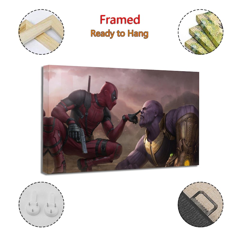 May include: Framed canvas art featuring Deadpool and Thanos in a dramatic pose. Deadpool, in a red and black suit, points at Thanos's nose. Thanos, in purple, wears gold armor. The text "Framed Ready to Hang" is at the top.