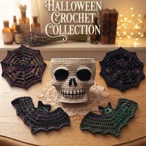 May include: A crochet collection featuring a beige skull-shaped basket, two dark purple spider web coasters, and two bat-shaped coasters in shades of dark purple and green. The items are arranged on a wooden surface with a small lace doily underneath.
