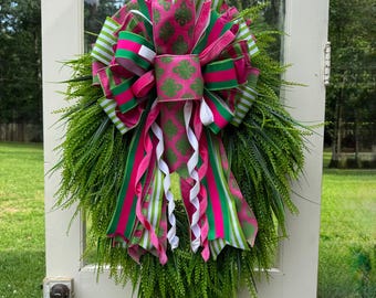 Corona de diseño Elite con lazo floral rosa para puerta