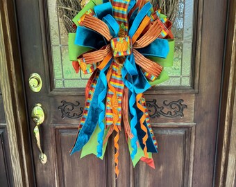 Lazo decorativo otoñal con diseño de calabaza y cuadros, con detalles de terciopelo.