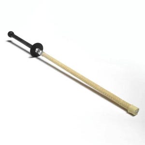 May include: A fire poi, a prop used for fire dancing. It features a black handle and a circular guard, with a beige, woven wick. The wick is attached to the handle with a metal connector. The poi is designed for performance and visual arts.